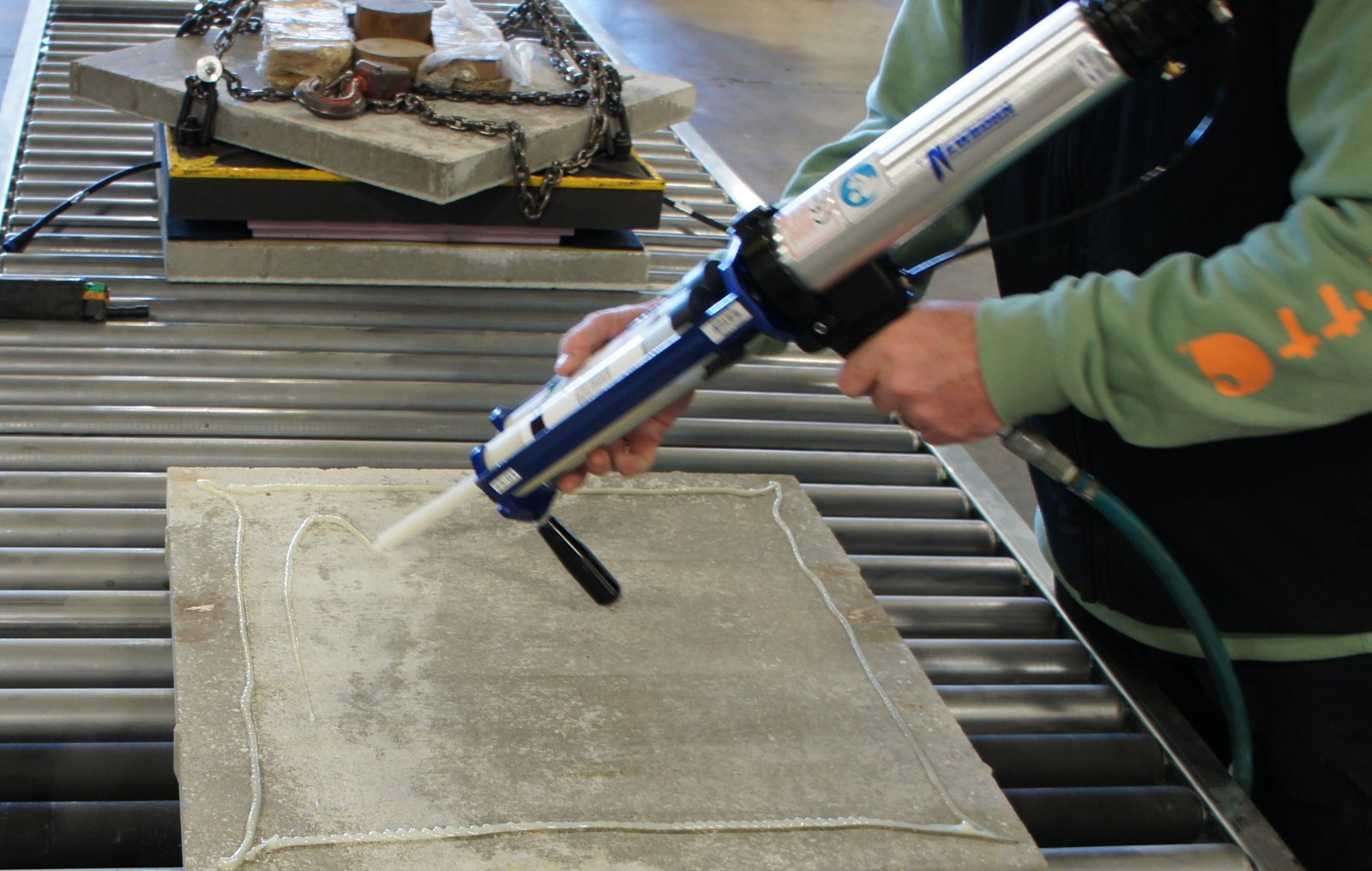 RPT adhesive being applied to a panel during installation